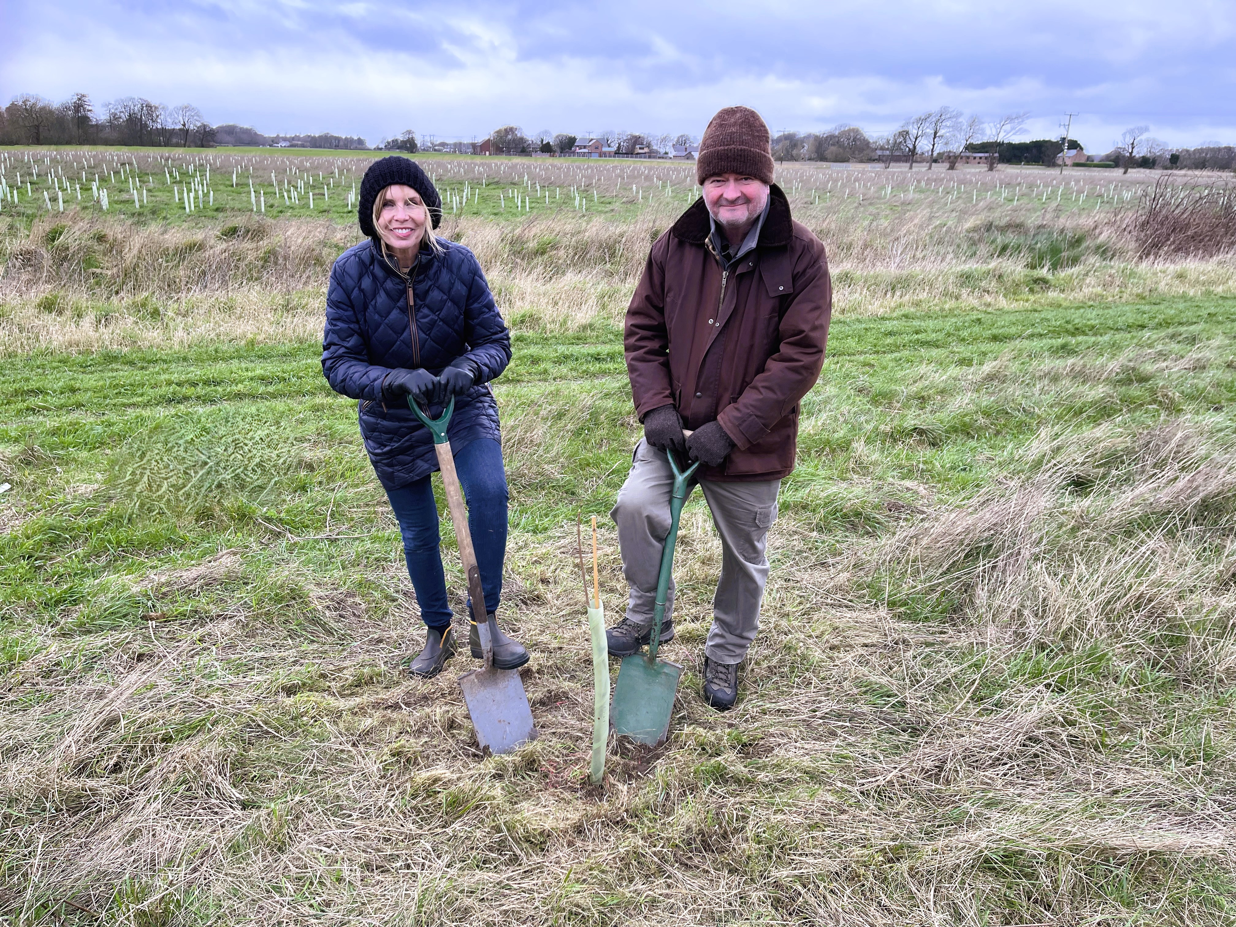 Cllr Liz Dowd and Cllr Ian Moncur with spades 