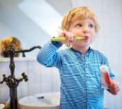 child brushing teeth