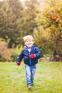 child running on grass