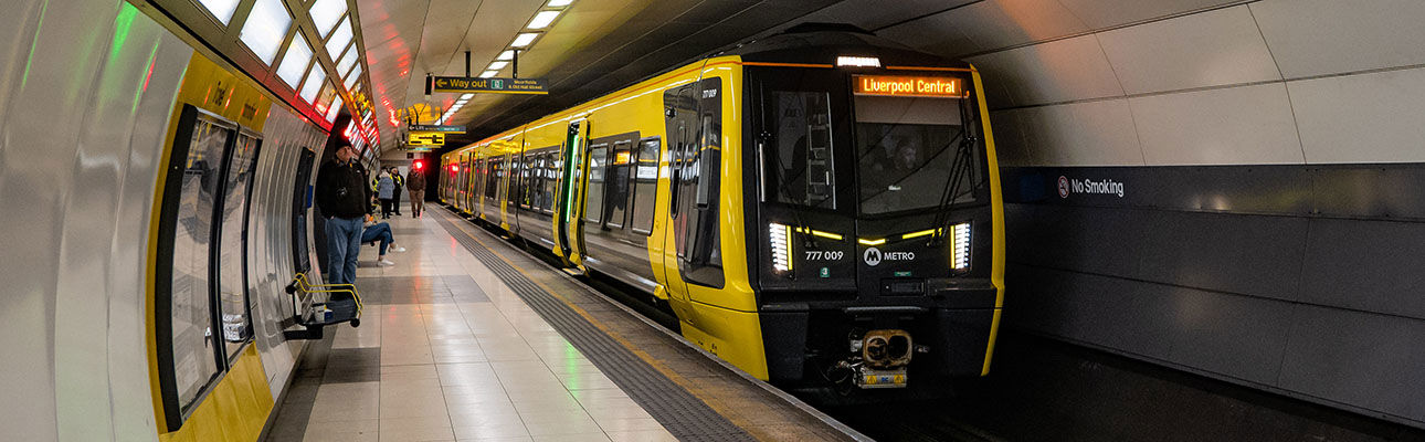 A merseyrail train in an underground station 