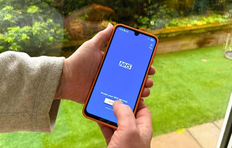 Person using the NHS App on a mobile phone