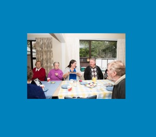 People enjoying a community lunch