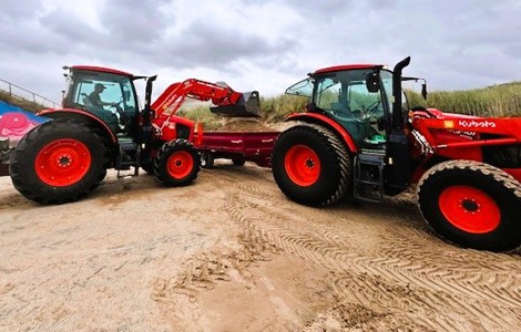 Tractors clearing sand at Ainsdale beach